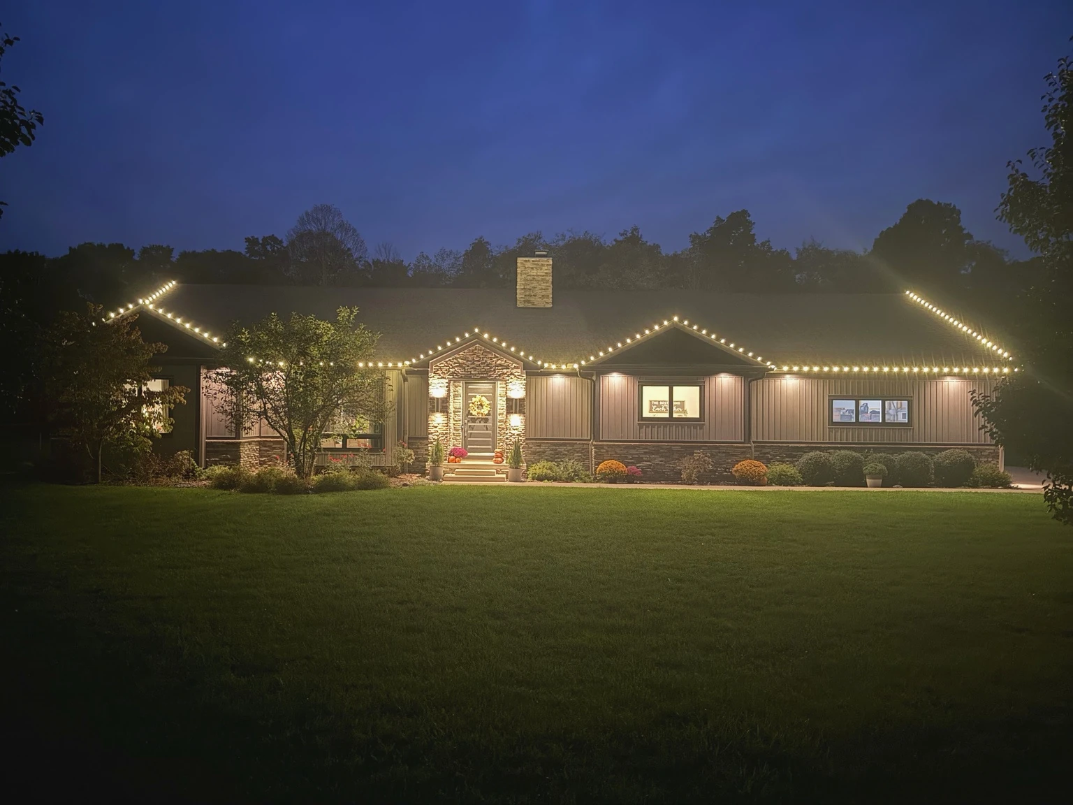 Featured Summit Wash Christmas lighting installation photographed at night.
