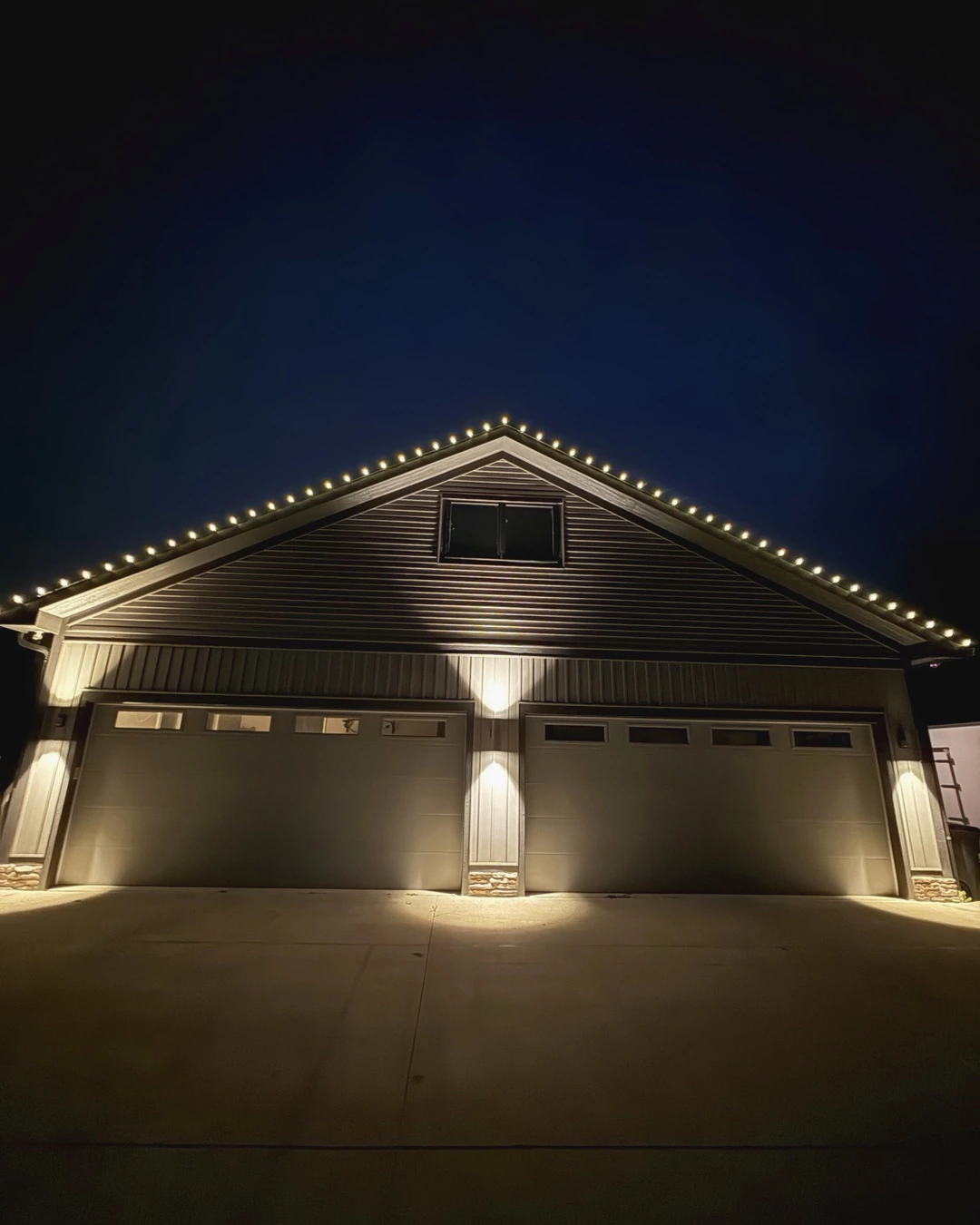 Christmas lights outlining the gutters and peaks of a home in southern Ohio.
